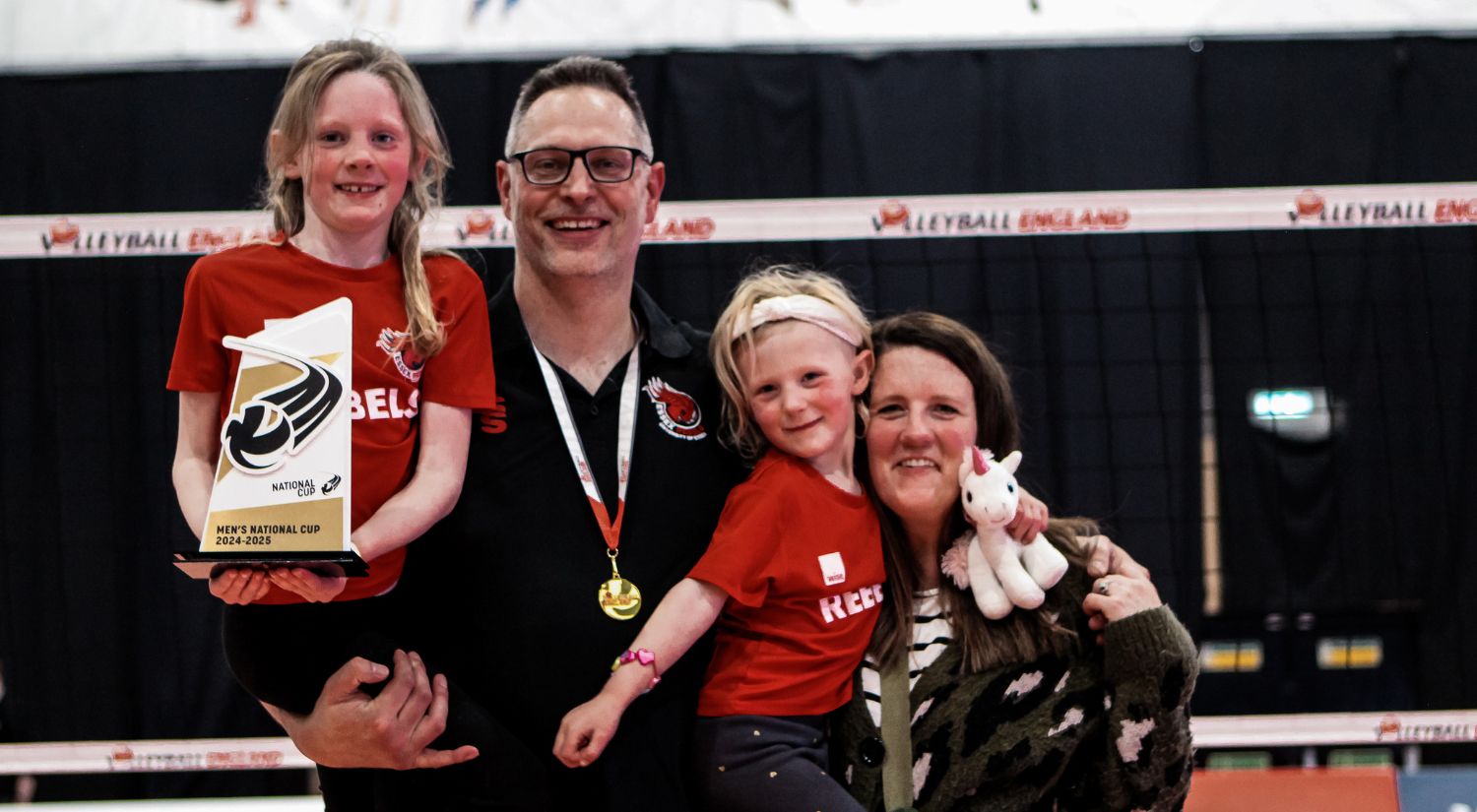 Coach Alex Porter and his family celebrate the win