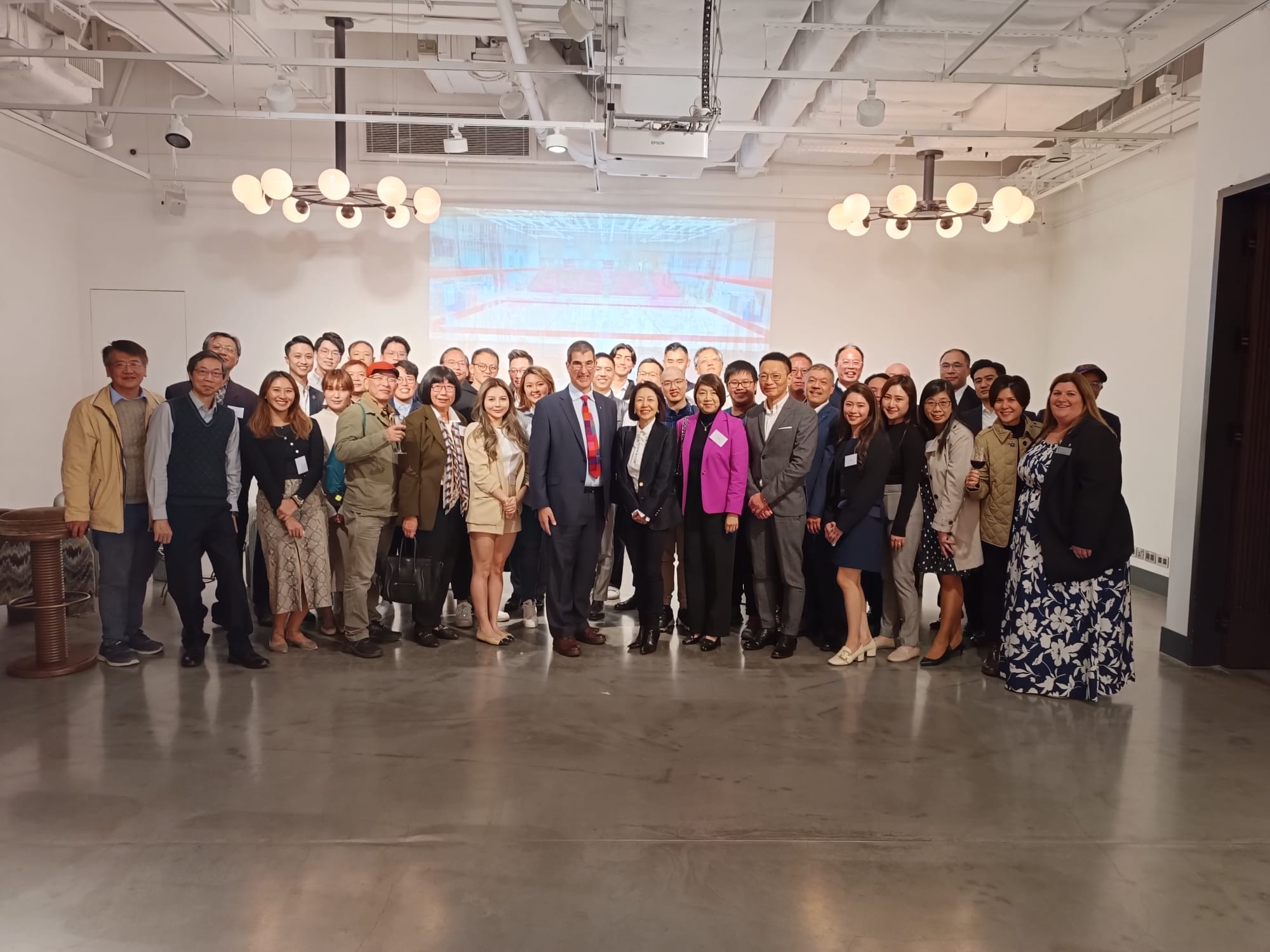 A group of almost 60 alumni together, the Vice-Chancellor in the middle, at Soho House