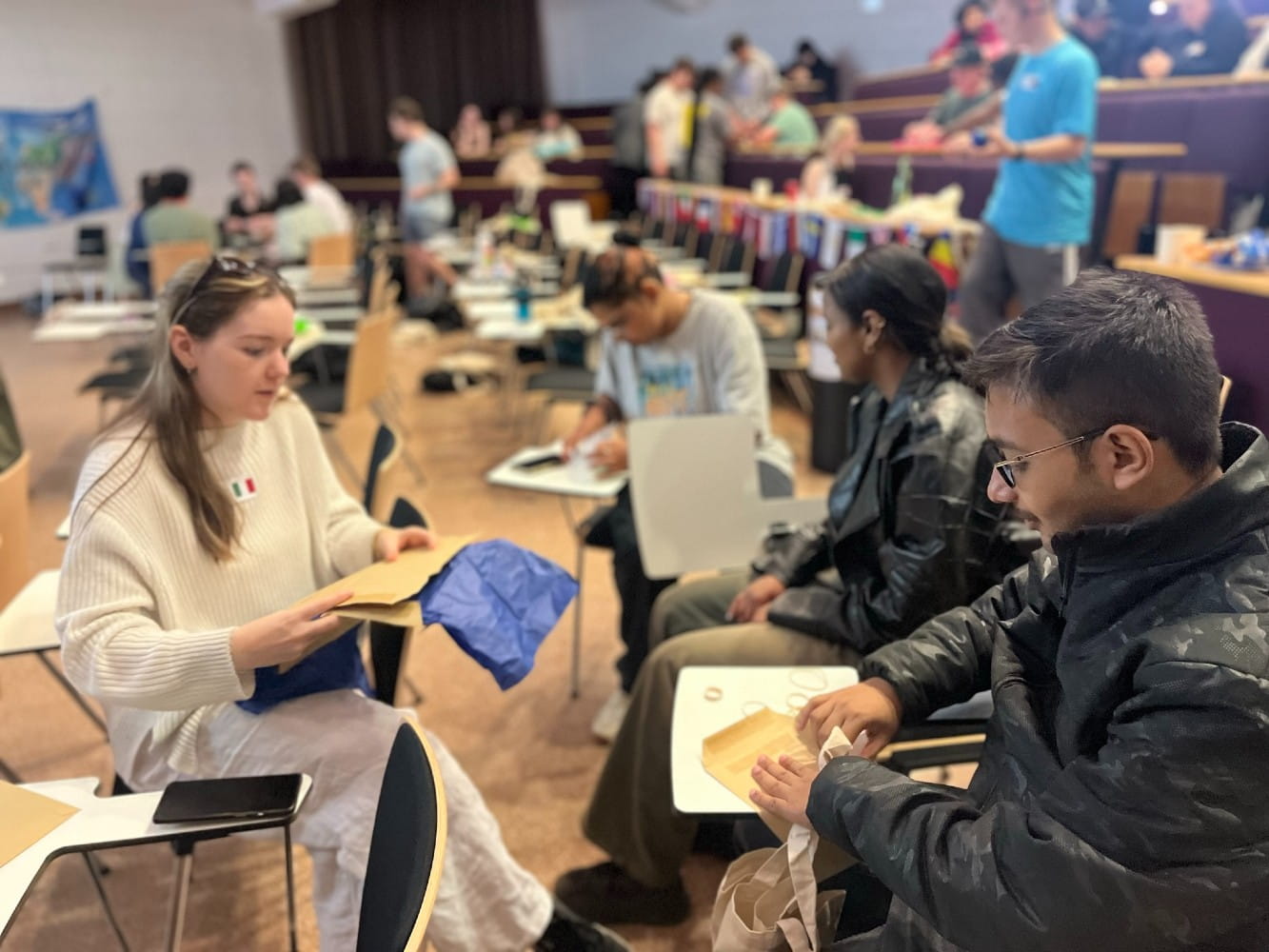 Students at a mixer event sitting together