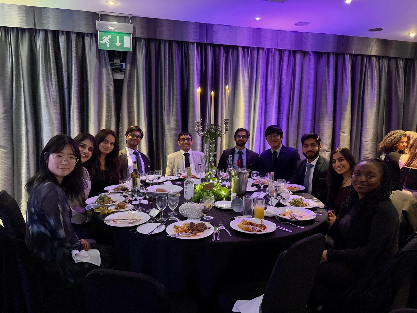 Group photo of delegates at dinner