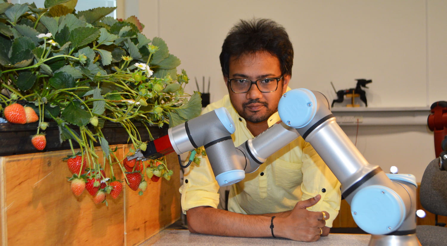 Dr Vishuu Mohan with the robotic arm.