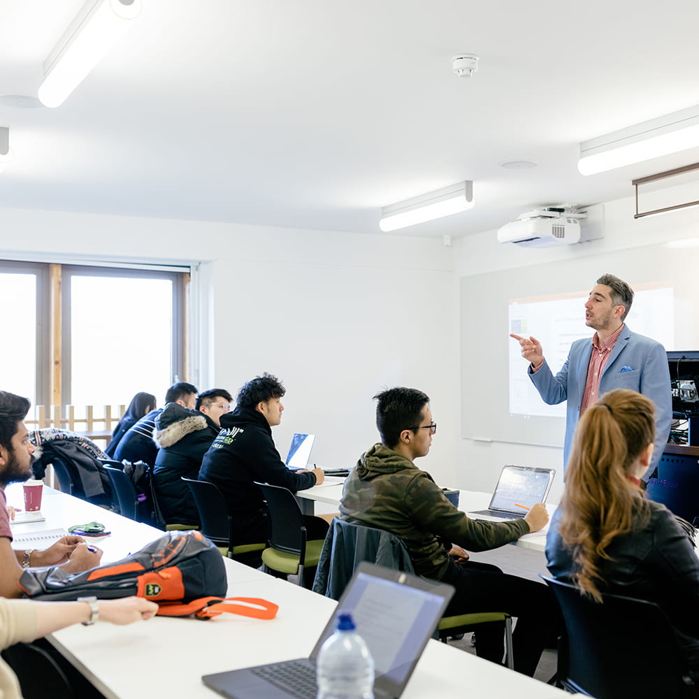 Lecturer speaking to a room of students